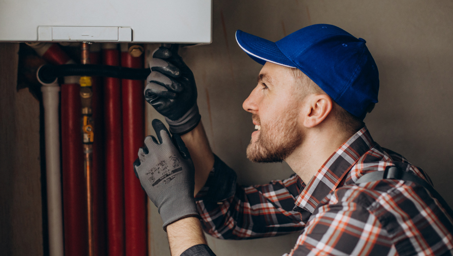 25 Service Man Adjusting House Heating System